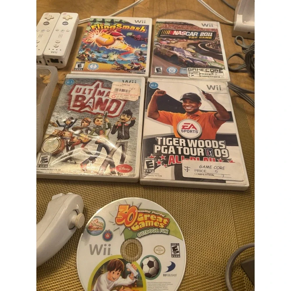 Nintendo Wii Console bundle + 5 games w  2 remotes 3 nunchucks wires and charger